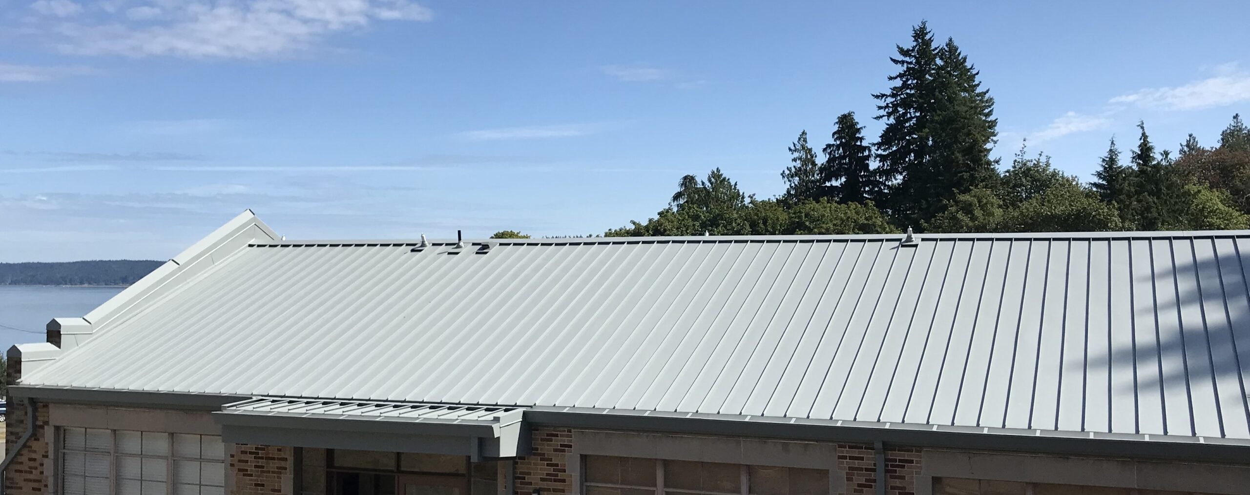 Metal Panels installed near a Marine Environment featuring standing seam metal roofing.